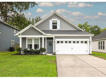 Charming single-Gathering home featuring a well-manicured lawn and a two-car garage at 3257 Timberline Dr, Johns Island, SC 29455