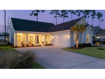 Charming single-story home with an attached garage, inviting front porch, and a well-manicured lawn at 357 Tupelo Lake Dr, Summerville, SC 29486