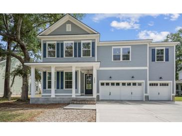 Charming two-story home with blue shutters and a welcoming front porch at 2006 Riverbend Dr, Charleston, SC 29412