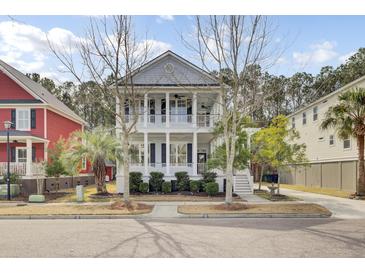 Charming two-story home boasts double porches, manicured landscaping, and inviting curb appeal at 2516 Willbrook Ln, Mount Pleasant, SC 29466