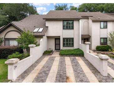Charming townhome with striped driveway and tasteful landscaping at 321 Lapwing Ln, Mount Pleasant, SC 29464