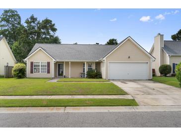 Charming single-story home with a well-maintained lawn and attached garage, offering curb appeal at 432 Equinox Cir, Ladson, SC 29456
