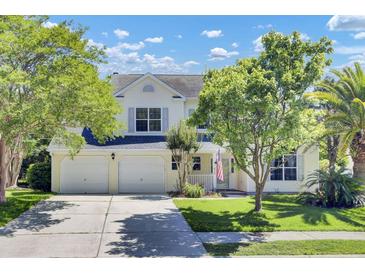 Charming two-story home with a well-maintained lawn, two-car garage, and welcoming curb appeal at 434 Antebellum Ln, Mount Pleasant, SC 29464