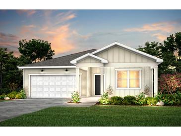 Charming one-story home with a two-car garage, verdant lawn, and meticulously manicured landscaping at 766 Meadowbrook Lane, Summerville, SC 29486