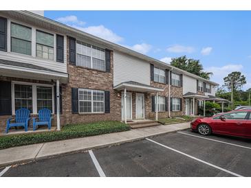 Inviting brick and vinyl townhome featuring private entrances and designated parking at 2045 Rondo St # B, Charleston, SC 29414