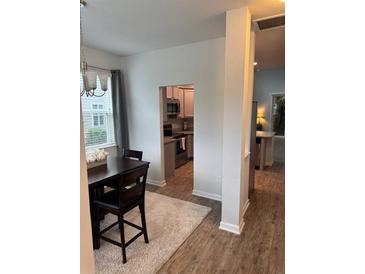 Inviting dining area with a dark wood table set and plush rug at 9410 Sweep Dr, Summerville, SC 29485