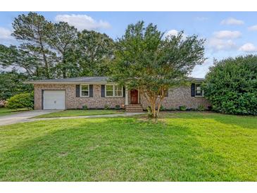 Charming brick ranch home with a manicured lawn and mature trees in a desirable neighborhood at 1 Bossis Dr, Charleston, SC 29407