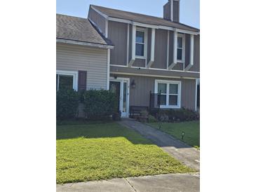 Charming home featuring light colored wood and a manicured lawn, providing inviting curb appeal at 11 Hunters Ct, Goose Creek, SC 29445