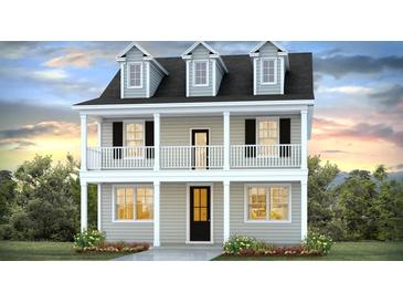 Charming two-story home featuring a welcoming front porch, classic columns, and dormer windows providing plenty of natural light at 201 Terrace View Dr, Summerville, SC 29486