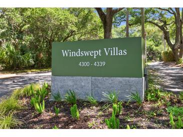 A sign for Windswept Villas features the address range and manicured landscaping at 4303 Sea Forest Dr, Kiawah Island, SC 29455