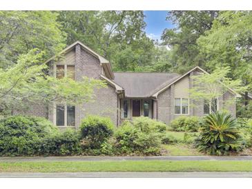 Charming brick home with mature landscaping and a welcoming front facade at 103 Kenninghall Rd, Goose Creek, SC 29445