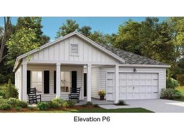 Charming single-Gathering home featuring a welcoming front porch and a convenient attached garage at 104 Orchard Blossom Ln, Summerville, SC 29485