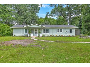 Charming one-story home with a landscaped yard and inviting curb appeal at 1314 Cooper Store Rd, Moncks Corner, SC 29461