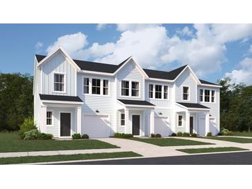 Charming exterior view of new build townhomes with light blue siding and a one car garage at 205 Agrarian Ave, Summerville, SC 29485