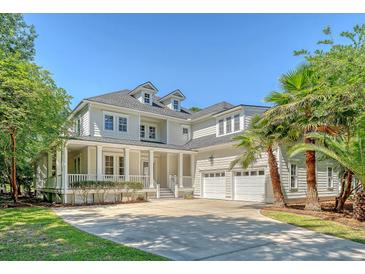 Charming two-story home with a large front yard, two-car garage and inviting front porch at 2701 Fountainhead Way, Mount Pleasant, SC 29466