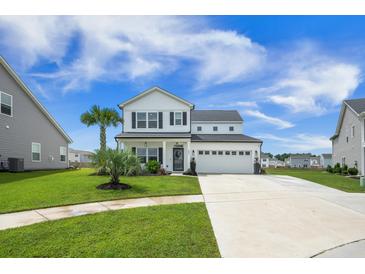 Charming two-story home with a well-manicured lawn and inviting curb appeal, complete with a two-car garage at 603 Cavour Ct, Summerville, SC 29486