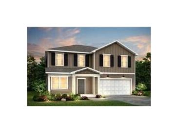 Charming two-story home featuring a two-car garage, classic design, and attractive curb appeal at 725 Meadowbrook Ln, Summerville, SC 29486