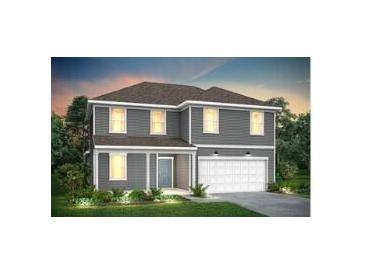 Charming two-story home featuring gray siding, a two-car garage, and a well-manicured lawn at 754 Meadowbrook Ln, Summerville, SC 29486