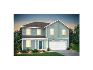 Charming two-story home with attached garage, beautiful siding, and well-maintained landscaping at 770 Meadowbrook Ln, Summerville, SC 29486