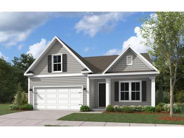 Charming one story home showcasing a two-car garage and traditional design elements at 772 Opal Wing St, Moncks Corner, SC 29461