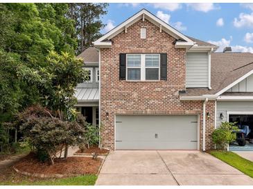 Beautiful home featuring brick, siding, a two-car garage, and professionally landscaped front yard at 2688 Jacana Ct, Mount Pleasant, SC 29466