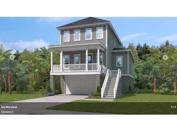 Charming two-story home with a welcoming porch, garage, and beautifully landscaped yard at 3041 Robeson Trce, Johns Island, SC 29455