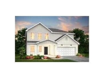 Charming two-story home featuring a crisp white exterior, well-manicured lawn and a two car garage at 724 Meadowbrook Ln, Summerville, SC 29486