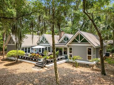 Charming home exterior with a spacious deck, perfect for outdoor living and entertaining at 2500 The Bent Twig, Seabrook Island, SC 29455