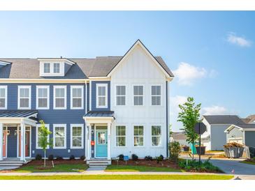 Charming townhomes showcasing craftsman-style architecture with eye-catching blue and white exteriors at 757 Blueway Ave, Summerville, SC 29486