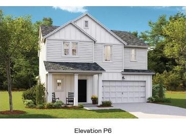 Charming two-story home featuring a two-car garage, covered front porch, and a well-manicured lawn at 107 Lefton Lndg, Summerville, SC 29485