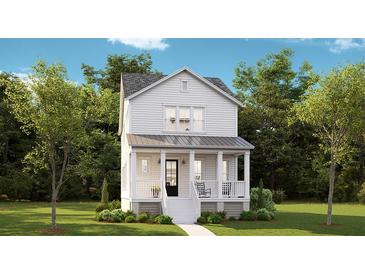 Charming two-story home with a welcoming front porch and lush landscaping, offering a picturesque curb appeal at 115 Battle Boat Blvd, Summerville, SC 29485