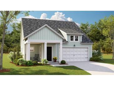 Charming single-Gathering home featuring a covered porch, attached garage, and landscaped front yard at 115 Lefton Lndg, Summerville, SC 29485