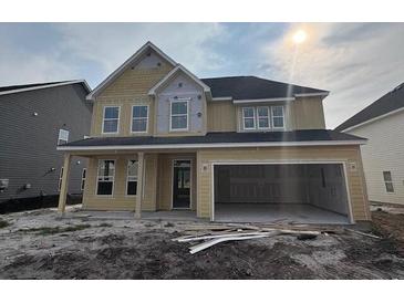 New two-story home featuring a spacious two-car garage and unfinished landscaping at 119 Crosscut Ln, Summerville, SC 29486