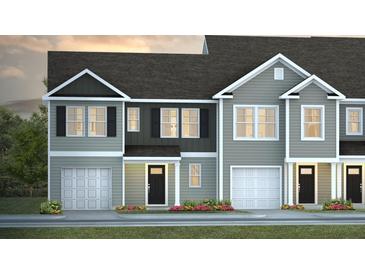 Charming townhomes with gray siding, black shutters, and attached garages create a welcoming curb appeal at 144 Haventree Ct, Summerville, SC 29486