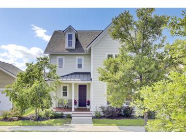 Charming two-story home featuring manicured landscaping and a welcoming front porch perfect for relaxing at 312 Greenhouse, Summerville, SC 29485