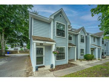 Charming townhouse with light blue siding and well-maintained landscaping at 1686 Hunters Run Dr, Mount Pleasant, SC 29464