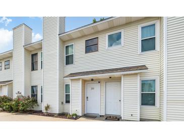 Charming townhouse with neutral siding, and a manicured garden, offering a welcoming curb appeal at 201 Pine Shadow Dr, Goose Creek, SC 29445