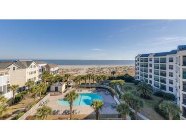 Beautiful aerial view of beachside community with a pool and ocean views from the condos at 509 Summerhouse, Isle of Palms, SC 29451