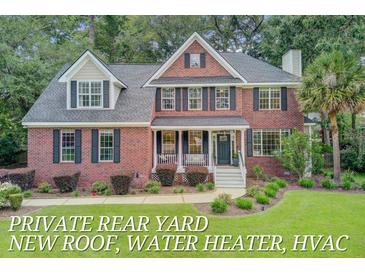Charming brick home with a welcoming front porch and beautifully landscaped yard at 1200 Out Of Bounds Dr, Summerville, SC 29485