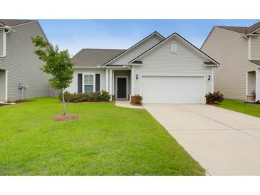 Charming single-Gathering home with a well-manicured lawn and a two-car garage in a suburban neighborhood at 158 Hayworth Rd, Summerville, SC 29486