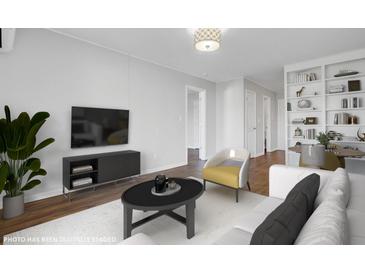 Bright living room features modern decor and a stylish entertainment center at 259 E Bay St # 7C, Charleston, SC 29401