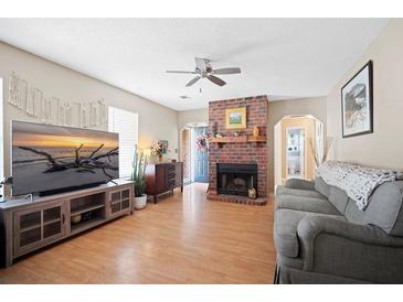 Inviting living room featuring a brick fireplace and modern decor at 503 Amberjack Way, Summerville, SC 29485