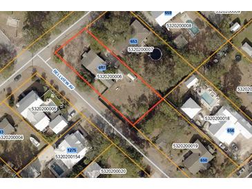 This aerial view showcases a property with clearly marked boundary lines in a residential neighborhood at 647 Ellis St, Mount Pleasant, SC 29464