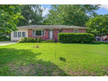 Charming single-story brick home with a well-maintained lawn and mature trees at 2903 Shadow Ln, North Charleston, SC 29406