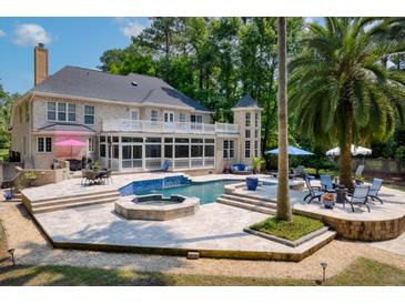 Beautiful backyard features a pool, spa, and patio, perfect for outdoor entertaining at 3685 Colonel Vanderhorst Cir, Mount Pleasant, SC 29466