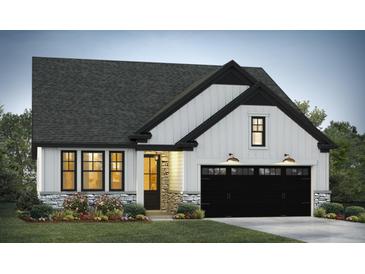Charming new home featuring a two-car garage, stone accents, and a welcoming front porch at 3006 Abagail Ct, North Charleston, SC 29406