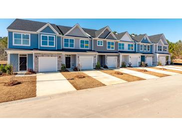 New townhomes feature craftsman style elevations, private garages, and inviting curb appeal at 420 Duskywing Dr, Goose Creek, SC 29445