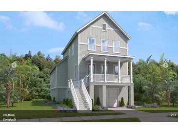 Charming two-story home with a welcoming porch and a well-maintained, landscaped yard at 617 Du Bois Dr, Johns Island, SC 29455