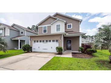 Charming two-story home with a well-maintained lawn, featuring a two car garage and neutral color palette at 107 Brookhaven Rd, Summerville, SC 29486