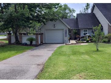 Charming single-story home with a well-maintained front yard and a cozy, inviting entrance at 15 A Par Dr # 27, Charleston, SC 29414